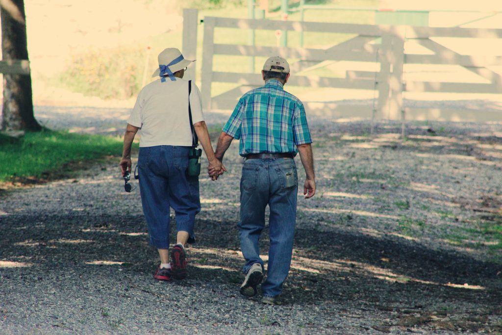 old-couple-walking-while-holding-hands-906111-1024x683